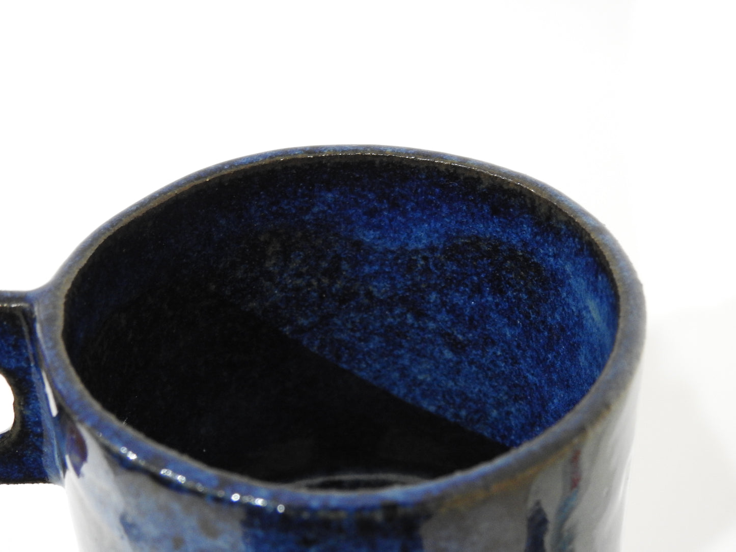 handmade ceramic mug with square handle
unique blue ceramic cappuccino cup
modern artisan pottery coffee mug
handcrafted stoneware espresso cup
minimalist handmade ceramic tea cup