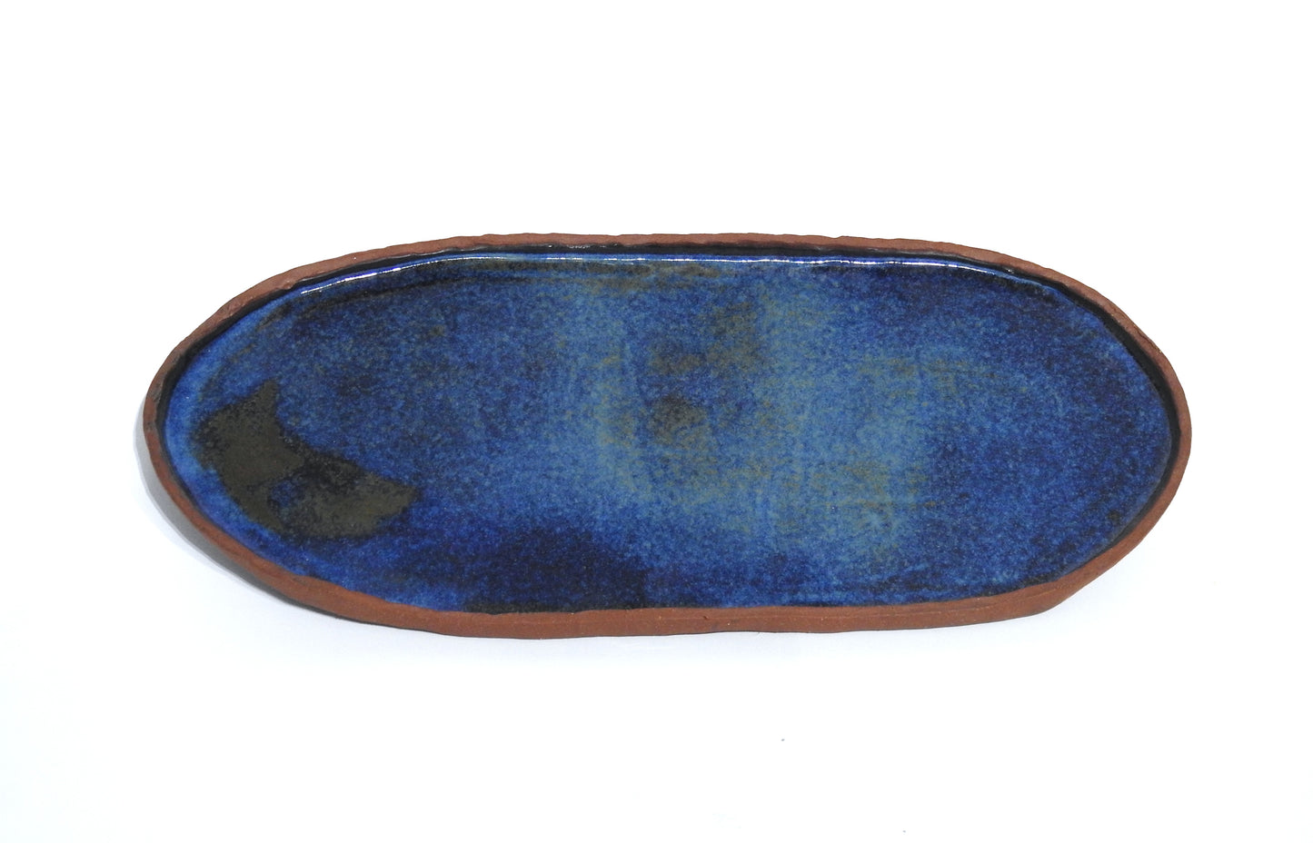 Oval ceramic tray with blue interior and brown made of red stoneware