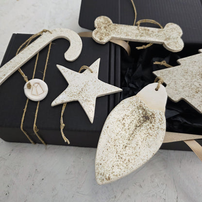 Box 7 is a handcrafted gift box with shredded paper, featuring luxury ceramic ornaments in star, candy cane, light bulb, Christmas tree, bone, and round tag shapes—ideal for elegant Christmas gifting.