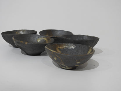 The SOIL SMALL DIP BOWL showcases authentic Greek craftsmanship with an earthy, textured finish and natural color variations—each handmade stoneware bowl is unique.