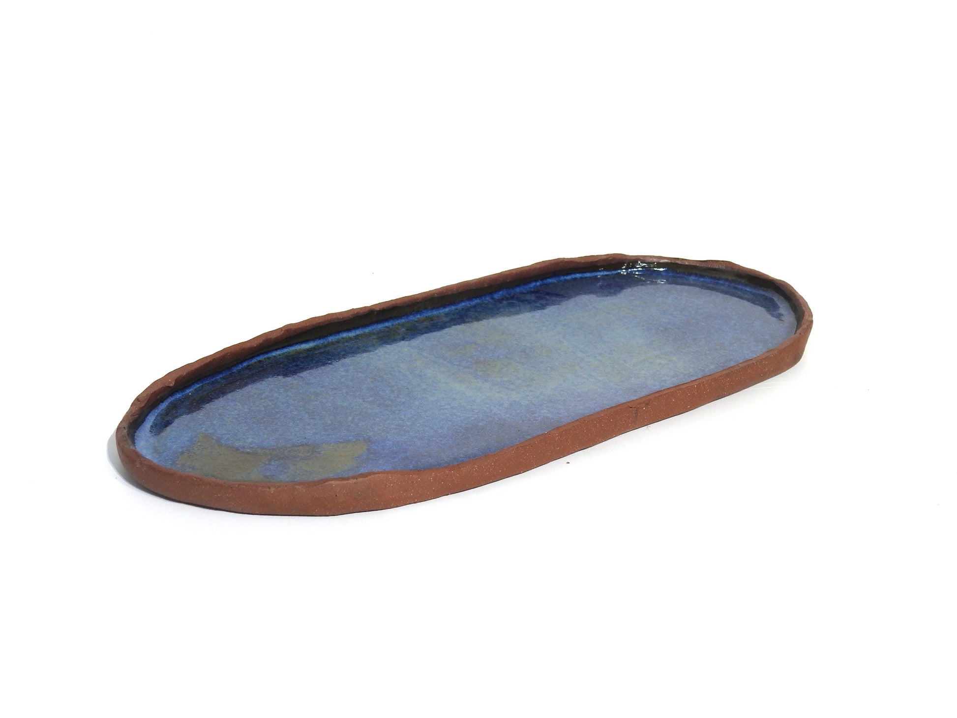 Oval ceramic tray with blue interior and brown made of red stoneware
