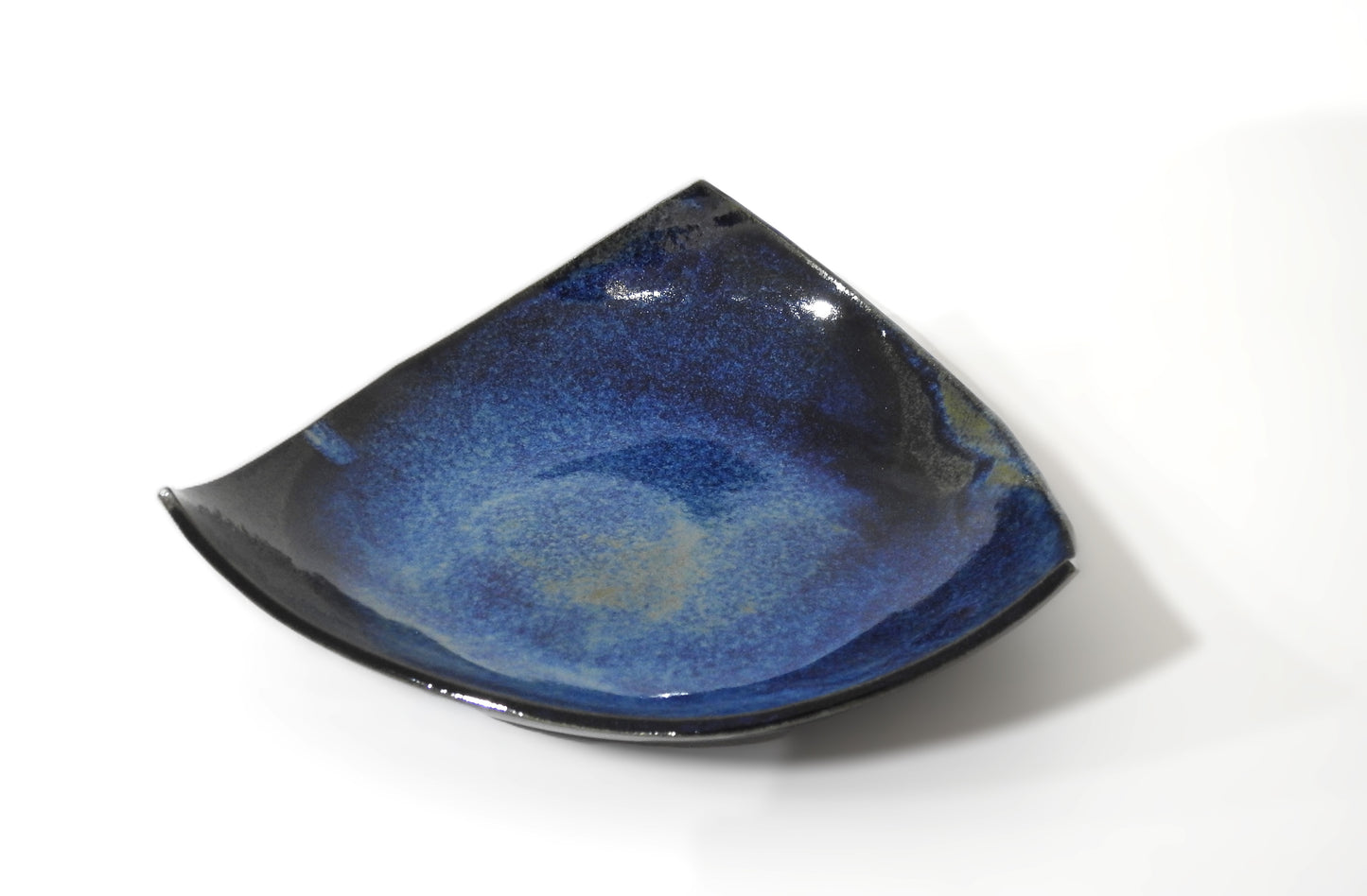 handmade triangular ceramic plate

minimalist deep blue ceramic dish

modern artisan tableware

unique handcrafted plate

decorative serving plate

contemporary minimalist kitchenware

small ceramic appetizer plate

artisanal ceramic home decor

handcrafted modern tableware

gift for ceramic lovers