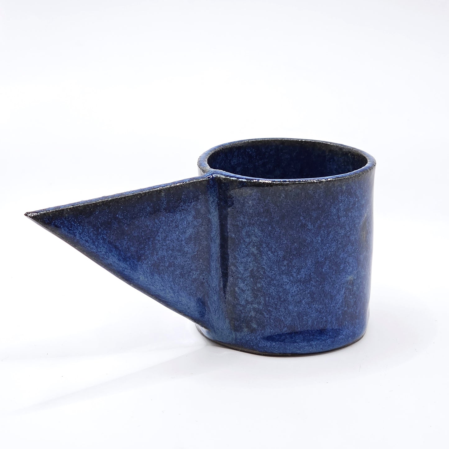 Blue ceramic cup 
with a conical shape 
