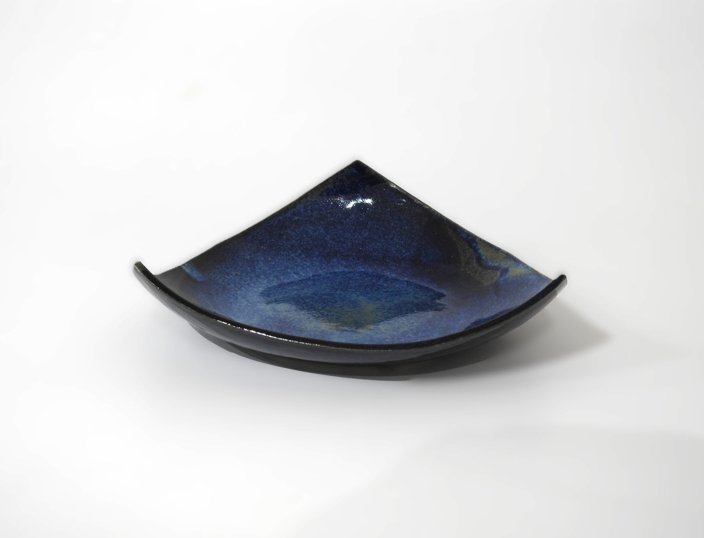 handmade triangular ceramic plate

minimalist deep blue ceramic dish

modern artisan tableware

unique handcrafted plate

decorative serving plate

contemporary minimalist kitchenware

small ceramic appetizer plate

artisanal ceramic home decor

handcrafted modern tableware

gift for ceramic lovers