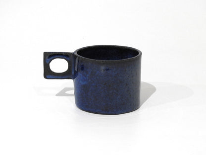 handmade ceramic mug with square handle

unique blue ceramic cappuccino cup

modern artisan pottery coffee mug

handcrafted stoneware espresso cup

minimalist handmade ceramic tea cup