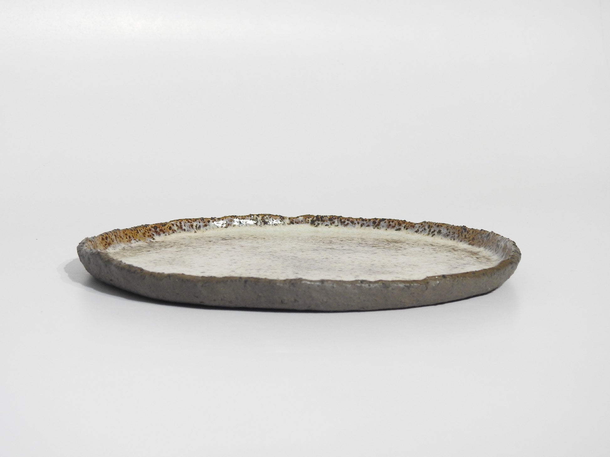 Handmade ceramic dinner plate set rustic stoneware tableware

Artisan ceramic serving plates handmade dinnerware earthy glaze

Rustic handmade ceramic plates set for dining and serving

Unique handcrafted stoneware dinner plates speckled ceramic design

Handmade ceramic tableware rustic dinner plates organic finish