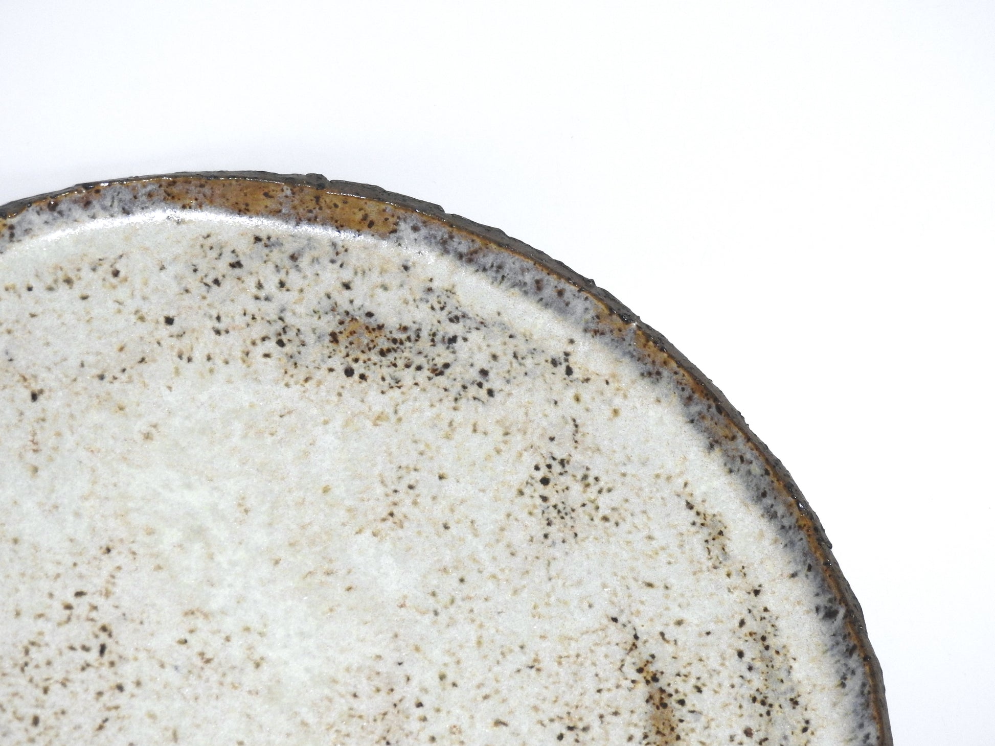 Elegant handmade ceramic plates, blending natural colors with artisan craftsmanship.