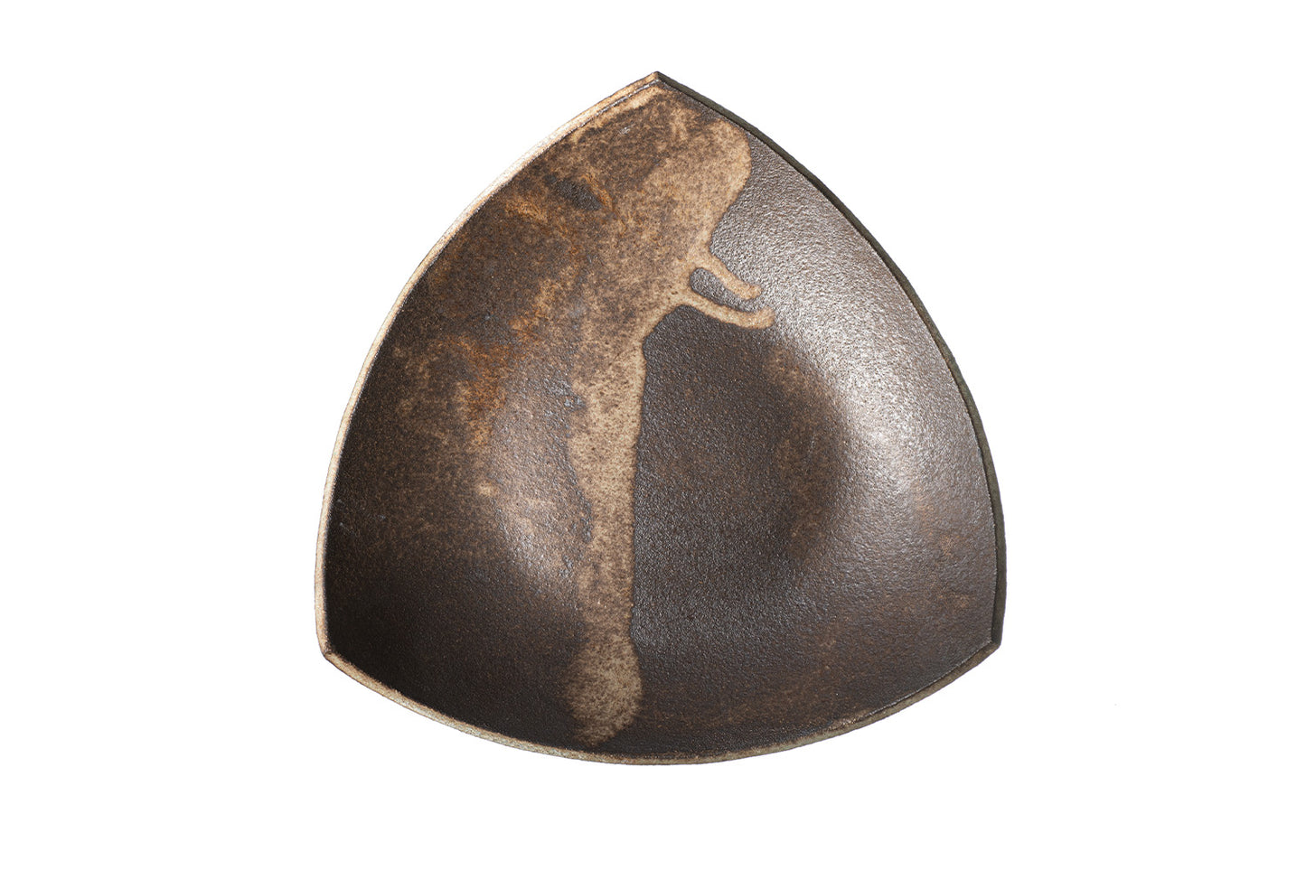 The SOIL TRIANGULAR PLATE is a handmade, dark ceramic plate with a teardrop shape, uneven surface, and a light brown textured streak running from the rim down the interior for an organic, rustic look.