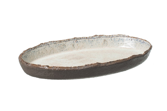 The STONE PLATTER is a rustic, handmade oval stoneware platter featuring a rough dark brown edge and a smooth, speckled light interior, shown against a white background.