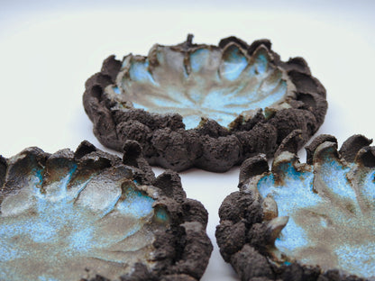  ceramic ash tray with textured surfaces and blue glaze black stoneware