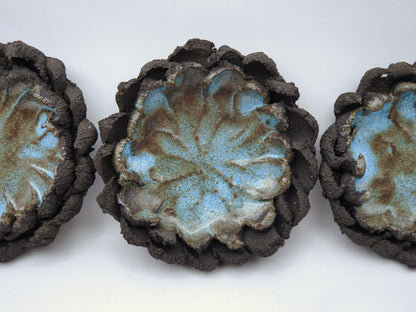  ceramic gift for smokers with textured surfaces and blue-green glaze on black clay